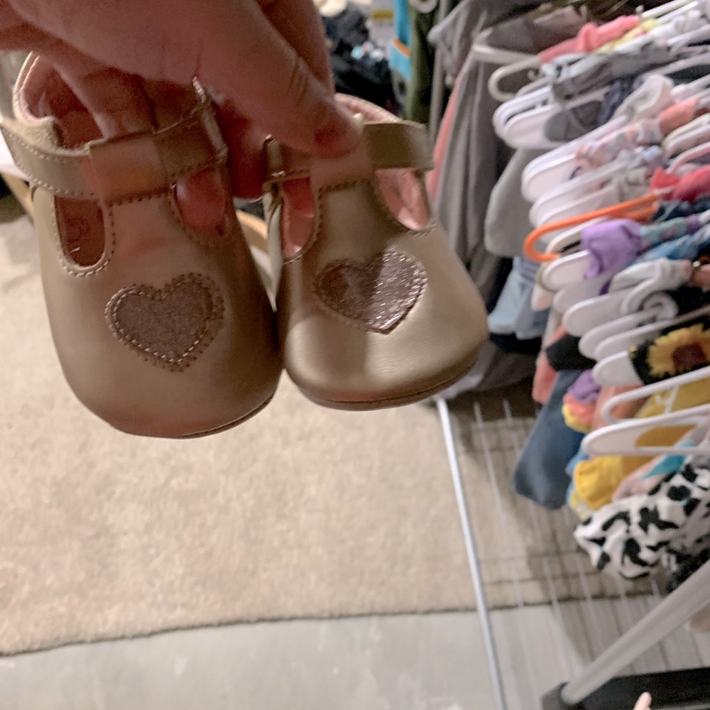 Surprise brand 6 to 12 month shoes. Gold with pink heart on them